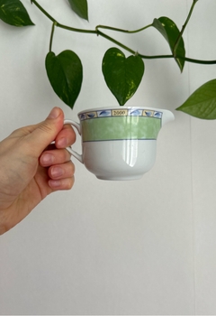 Green and white porcelain creamer