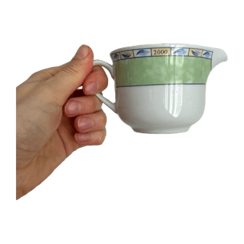 Green and white porcelain creamer