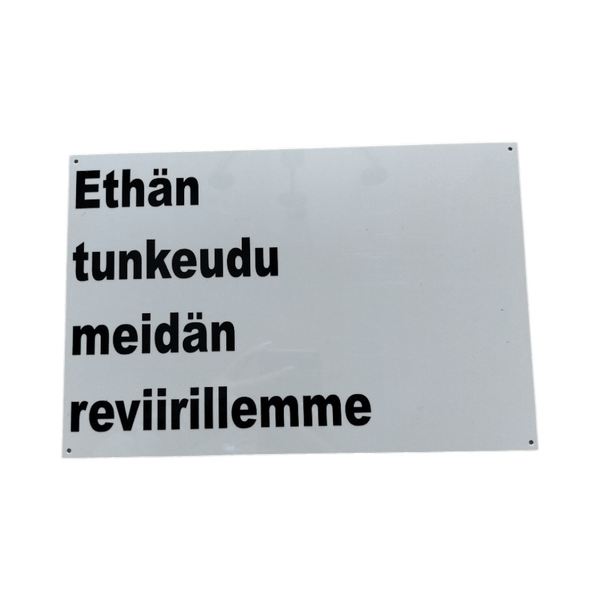 valkoinen kyltti teksti