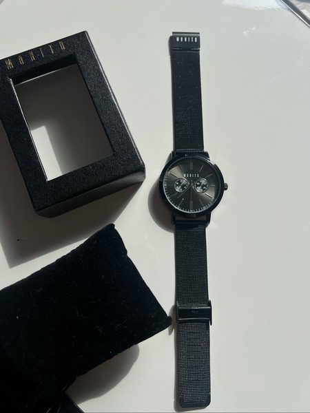 Black metal wristwatch