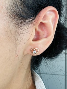 Gold heart stud earrings