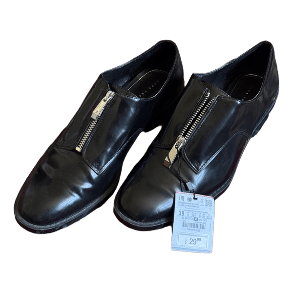 Mustat vetoketjulliset loaferit
