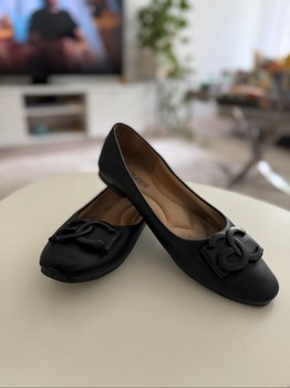 Black leather ballet flats