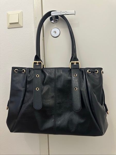 Black faux leather handbag