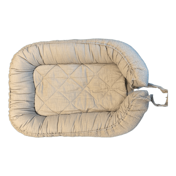 Beige quilted baby nest