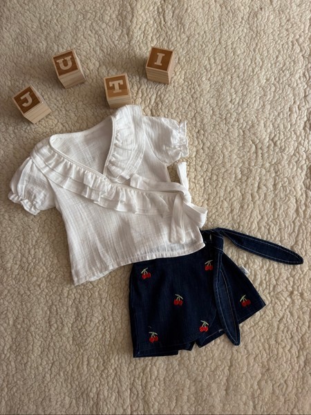 White muslin top and cherry denim shorts set