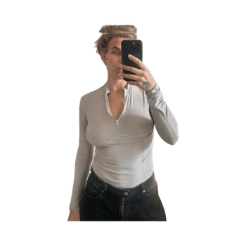 Grey long-sleeve bodysuit. 