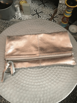 Pink leather clutch
