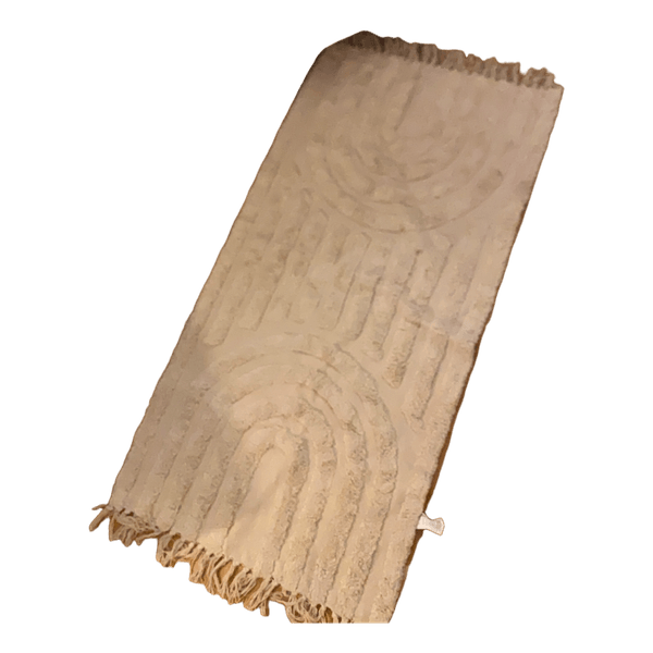 Beige tuftet tæppe