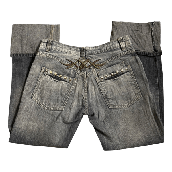 Low waisted denim jeans with studs and a tramp stamp