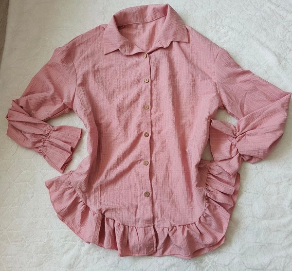 Pink ruffled button-down shirt