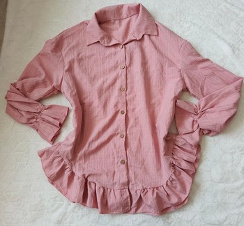 Pink ruffled button-down shirt
