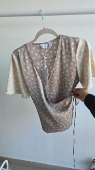 Beige patterned wrap top