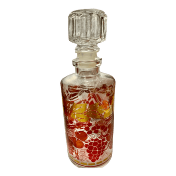 Glass decanter with grape motif