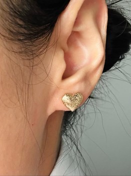 Gold heart stud earrings