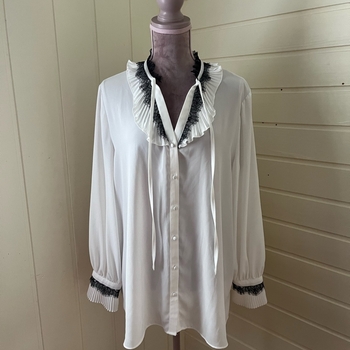 Sheer white blouse with lace details