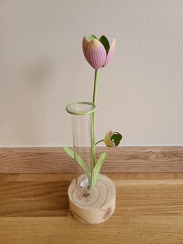 Glass vase with metal flowers
