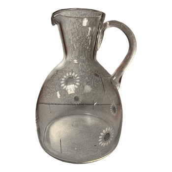 Glass pitcher with flowers