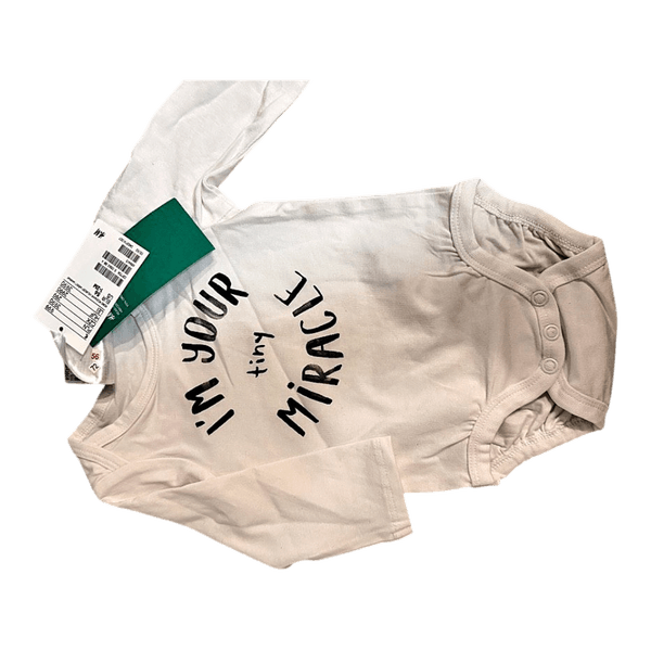 White baby bodysuit