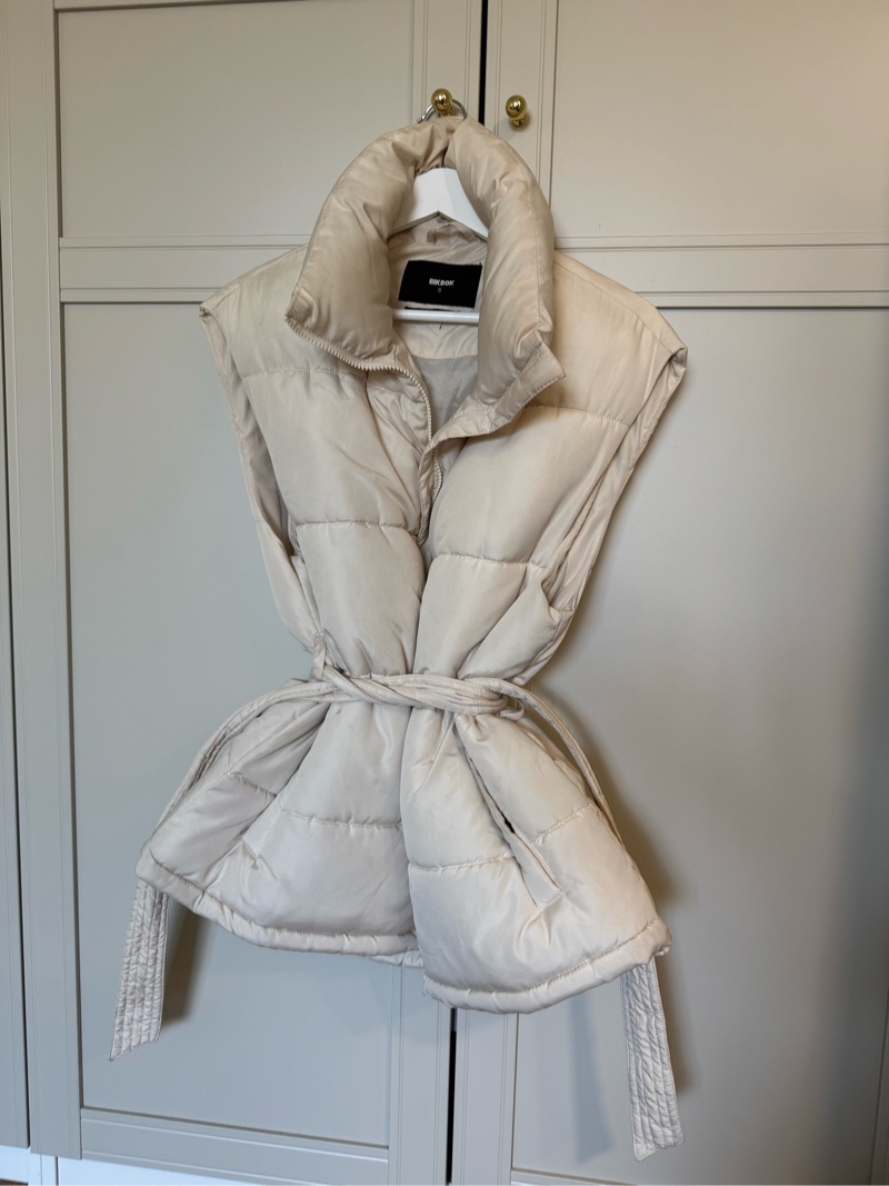 Beige padded sleeveless vest
