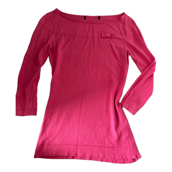 Vaaleanpunainen neulepaita rusetilla