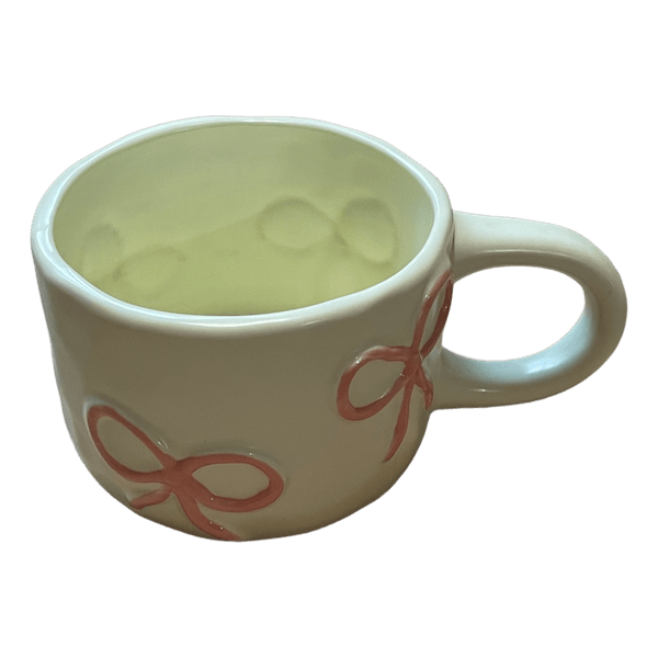 Cream ceramic bow mug