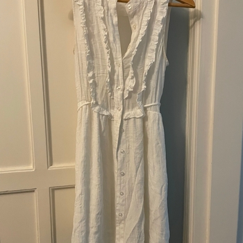 White sleeveless button dress