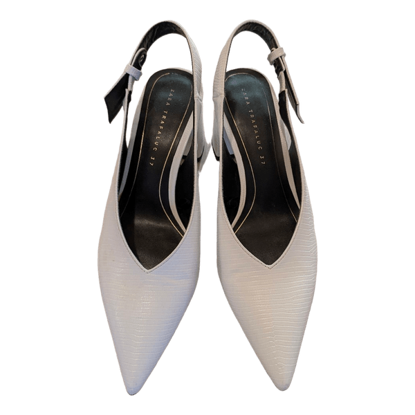 White pointed slingback heels