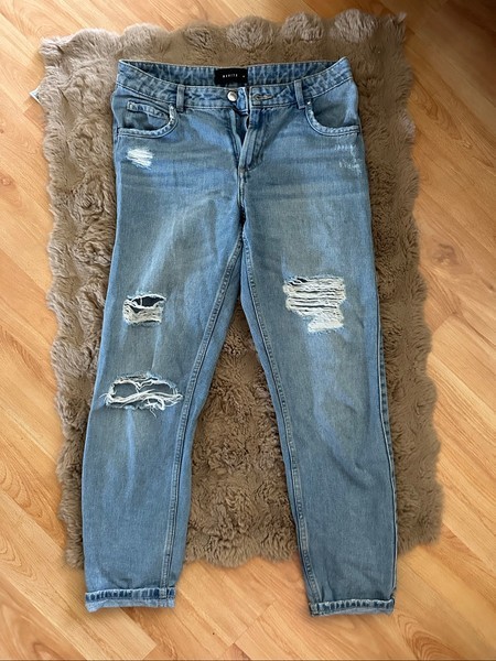 Blue distressed denim jeans