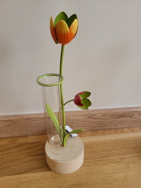 Glass vase with metal flowers