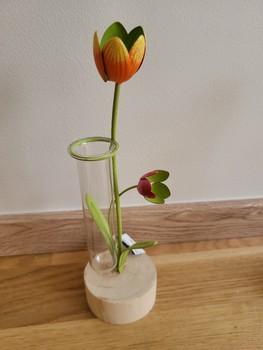 Glass vase with metal flowers