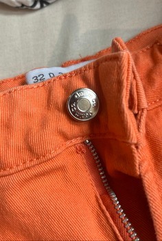 Orange denim trousers