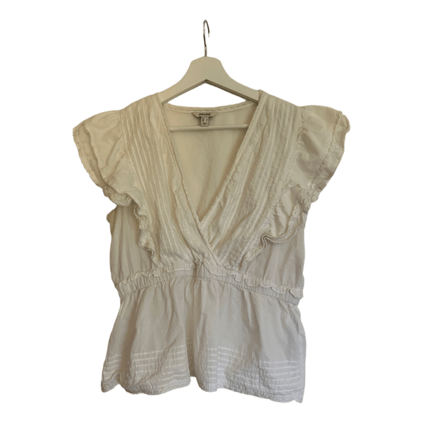 White ruffle sleeveless blouse
