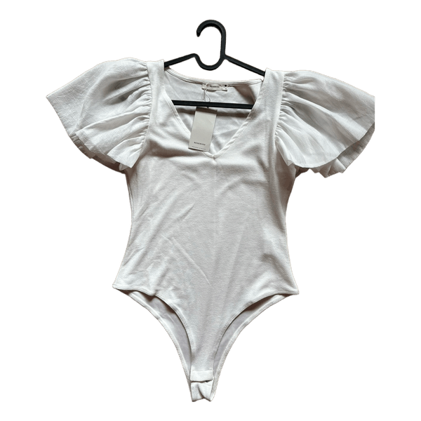 White textured bodysuit with puffy sleeves