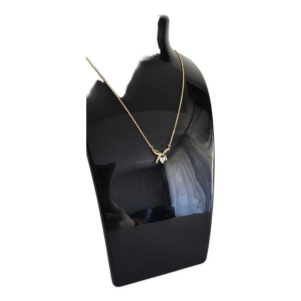 Gold tone bow necklace