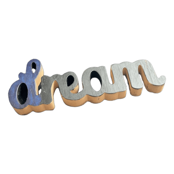 Træskilt med teksten dream
