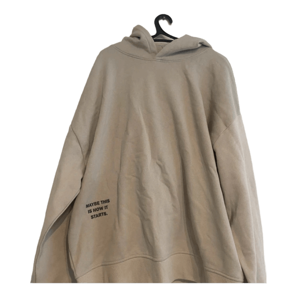 Beige huppari tekstillä