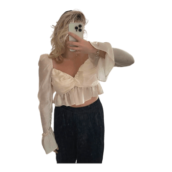 Creamy top with ruffles