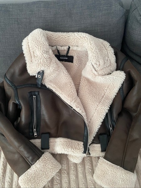 Brown and black varsity jacket