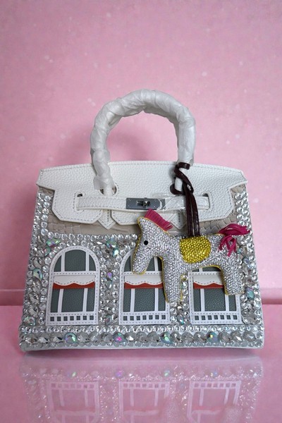 Bejeweled white handbag
