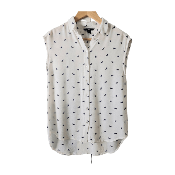 H&M valkoinen hihaton nappipusero