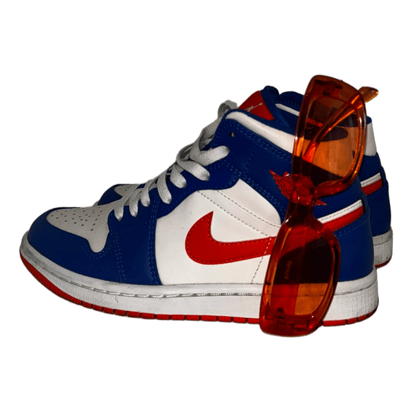 Nike sneakers with orange sunglasses