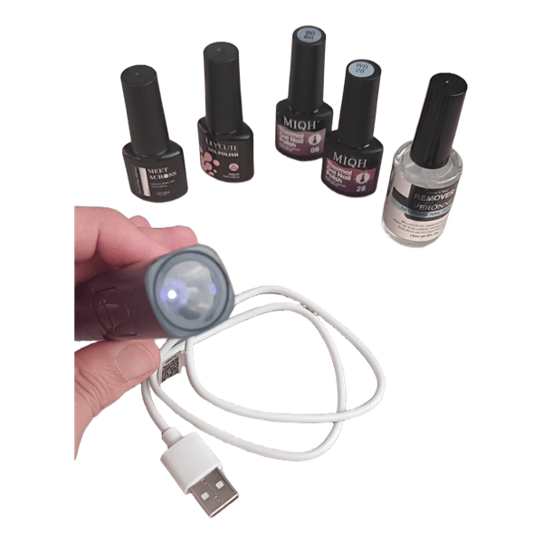 Gel nail kit with UV lamp
