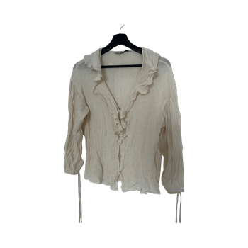 Beige ruffle pusero
